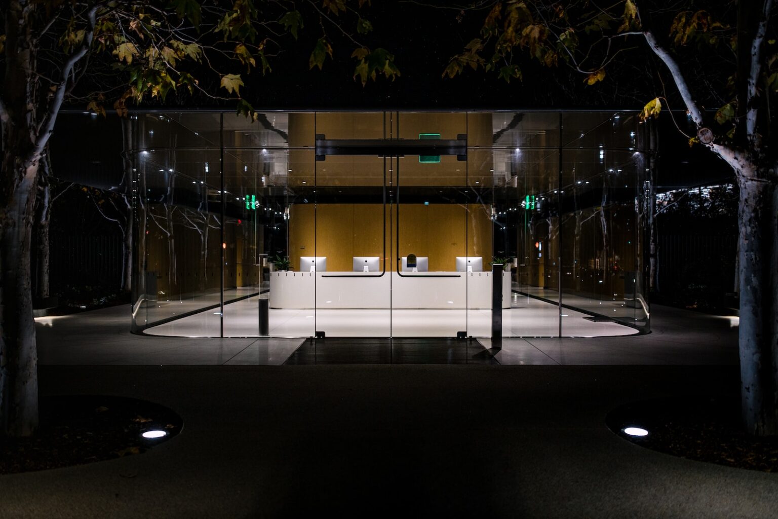 white and black building with glass walls